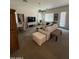 Well-lit living area with stylish decor, comfortable seating, and large windows for natural light at 14991 W Shaw Butte Dr, Surprise, AZ 85379