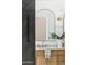 Bathroom vanity features marble countertops, modern lighting, and green foliage to add some color at 16428 N 59Th St, Scottsdale, AZ 85254