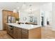 Island featuring stainless steel appliances and an open layout to the dining room at 16428 N 59Th St, Scottsdale, AZ 85254