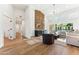 Bright living room with modern decor, wood floors, and a stylish bar area at 16428 N 59Th St, Scottsdale, AZ 85254