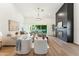 Bright living room with a sleek fireplace and large sliding doors to the backyard at 16428 N 59Th St, Scottsdale, AZ 85254