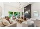 Cozy living room with a modern fireplace and an abundance of natural light at 16428 N 59Th St, Scottsdale, AZ 85254