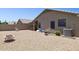 Low-maintenance backyard with gravel, patio area, and block wall, great for outdoor relaxation and gatherings at 17229 N 51St Dr, Glendale, AZ 85308