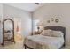This bedroom offers a calming retreat with large mirror, neutral tones, and access to an ensuite bathroom at 17229 N 51St Dr, Glendale, AZ 85308