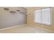 Bedroom with window for natural light and floating wall shelves, providing simple and modern storage at 17229 N 51St Dr, Glendale, AZ 85308