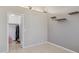 Neutral bedroom with a closet, and wall shelves, offering a minimalist and organized space at 17229 N 51St Dr, Glendale, AZ 85308