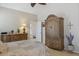 Main bedroom boasts an ornate wardrobe, dresser, and decorative accents for a stylish and organized space at 17229 N 51St Dr, Glendale, AZ 85308