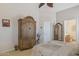 Bedroom featuring wood floors and a large armoire at 17229 N 51St Dr, Glendale, AZ 85308