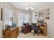 Inviting home office with wooden furniture and lots of natural light at 17229 N 51St Dr, Glendale, AZ 85308