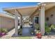 Covered patio featuring plants and access to backyard space for relaxing and outdoor enjoyment at 17229 N 51St Dr, Glendale, AZ 85308