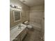 Bathroom features a shower-tub combo and vanity with sink at 189 Laguna E Dr, Litchfield Park, AZ 85340