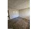 Cozy bedroom features neutral carpet and paint scheme and closet at 189 Laguna E Dr, Litchfield Park, AZ 85340