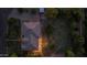 Aerial view of a house with a tiled roof, landscaped yard, and string lights in the backyard at 21228 E Excelsior Ave, Queen Creek, AZ 85142