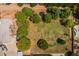 Aerial shot showcases a large backyard with mature trees, offering ample space for recreation and relaxation at 21228 E Excelsior Ave, Queen Creek, AZ 85142