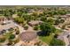 Beautiful aerial view of a home with a circular driveway and a lush green lawn at 21228 E Excelsior Ave, Queen Creek, AZ 85142