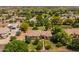 Aerial view of a home with mature trees in the front yard at 21228 E Excelsior Ave, Queen Creek, AZ 85142