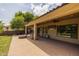 Beautiful backyard featuring a brick-paved patio, fire pit, and outdoor entertaining space at 21228 E Excelsior Ave, Queen Creek, AZ 85142