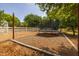 Backyard recreational area featuring a trampoline, ideal for Gathering fun and outdoor activities at 21228 E Excelsior Ave, Queen Creek, AZ 85142