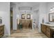 Bright bathroom with a copper soaking tub, wood accents, dual vanities, and a shower stall at 21228 E Excelsior Ave, Queen Creek, AZ 85142