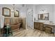 Bathroom with copper tub, vanity, decorative lighting, wood accents, and walk-in shower at 21228 E Excelsior Ave, Queen Creek, AZ 85142