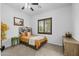 Bedroom featuring a bed, window with shutters, carpet floors, and a horse-themed painting at 21228 E Excelsior Ave, Queen Creek, AZ 85142