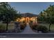 Charming home with stone accents, a tile roof, and a well-manicured front yard at 21228 E Excelsior Ave, Queen Creek, AZ 85142