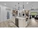 Spacious kitchen with a large island, modern appliances, and an open floor plan at 21228 E Excelsior Ave, Queen Creek, AZ 85142