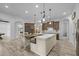 Bright and airy kitchen with an oversized island, wooden cabinetry, and plenty of workspace at 21228 E Excelsior Ave, Queen Creek, AZ 85142