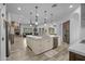 Open-concept kitchen with large island, modern appliances and views of the living spaces at 21228 E Excelsior Ave, Queen Creek, AZ 85142