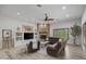 Spacious living room with stone fireplace, recessed lighting, and decorative horse painting at 21228 E Excelsior Ave, Queen Creek, AZ 85142