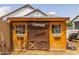Quaint backyard outbuilding with rustic details and unique design elements at 21228 E Excelsior Ave, Queen Creek, AZ 85142