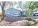 Charming single-story home featuring a front yard with mature trees and a relaxing hammock at 2335 W Campus Dr, Phoenix, AZ 85015