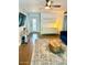 Comfortable living room with stylish decor, a large area rug, and built-in shelving at 2335 W Campus Dr, Phoenix, AZ 85015