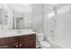 Bathroom featuring vanity, toilet, and bathtub with shower head at 2668 N 73Rd Gln, Phoenix, AZ 85035