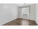 Simple bedroom with wood floors, natural light, and fresh white walls at 2668 N 73Rd Gln, Phoenix, AZ 85035
