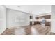A modern kitchen with stainless steel appliances, dark wood cabinets, and open floorplan at 2668 N 73Rd Gln, Phoenix, AZ 85035