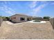 View of backyard with desert landscaping, fenced yard, and swimming pool at 2971 N Rosewood Ave, Casa Grande, AZ 85122