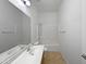 Bathroom with a single vanity, a mirror, and a tub with a shower, offering practical amenities at 2971 N Rosewood Ave, Casa Grande, AZ 85122