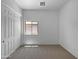Neutral bedroom featuring carpeted floors, a closet, and a window providing natural light at 2971 N Rosewood Ave, Casa Grande, AZ 85122