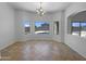 Elegant dining room featuring large windows with a view of the pool and backyard at 2971 N Rosewood Ave, Casa Grande, AZ 85122