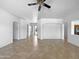 Bright living room with tile floors and white walls, creating a clean and spacious feel at 2971 N Rosewood Ave, Casa Grande, AZ 85122