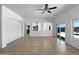 Light-filled living room with tiled floors, a ceiling fan, and sliding glass doors leading to the patio at 2971 N Rosewood Ave, Casa Grande, AZ 85122