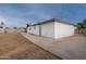 The backyard features a concrete patio and ample space, offering potential for customization at 3002 W Mandalay Ln, Phoenix, AZ 85053