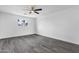 Bedroom features wood floors, white walls, and a ceiling fan at 3002 W Mandalay Ln, Phoenix, AZ 85053