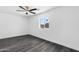 Bedroom features wood floors, white walls, and natural light at 3002 W Mandalay Ln, Phoenix, AZ 85053