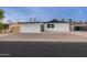 Charming single-story home boasting fresh exterior paint, a new roof, and desert landscaping at 3002 W Mandalay Ln, Phoenix, AZ 85053