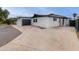 An exterior view of a modern home showcasing the garage and sleek design at 3002 W Mandalay Ln, Phoenix, AZ 85053