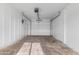 This unfinished garage features neutral paint and a roll-up door, ready for customization at 3002 W Mandalay Ln, Phoenix, AZ 85053