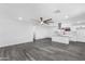 A spacious living area features sleek flooring, modern lighting, and an open concept design at 3002 W Mandalay Ln, Phoenix, AZ 85053