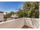 Balcony view looking out to a neighborhood with lush trees at 3150 E Beardsley Rd # 1091, Phoenix, AZ 85050